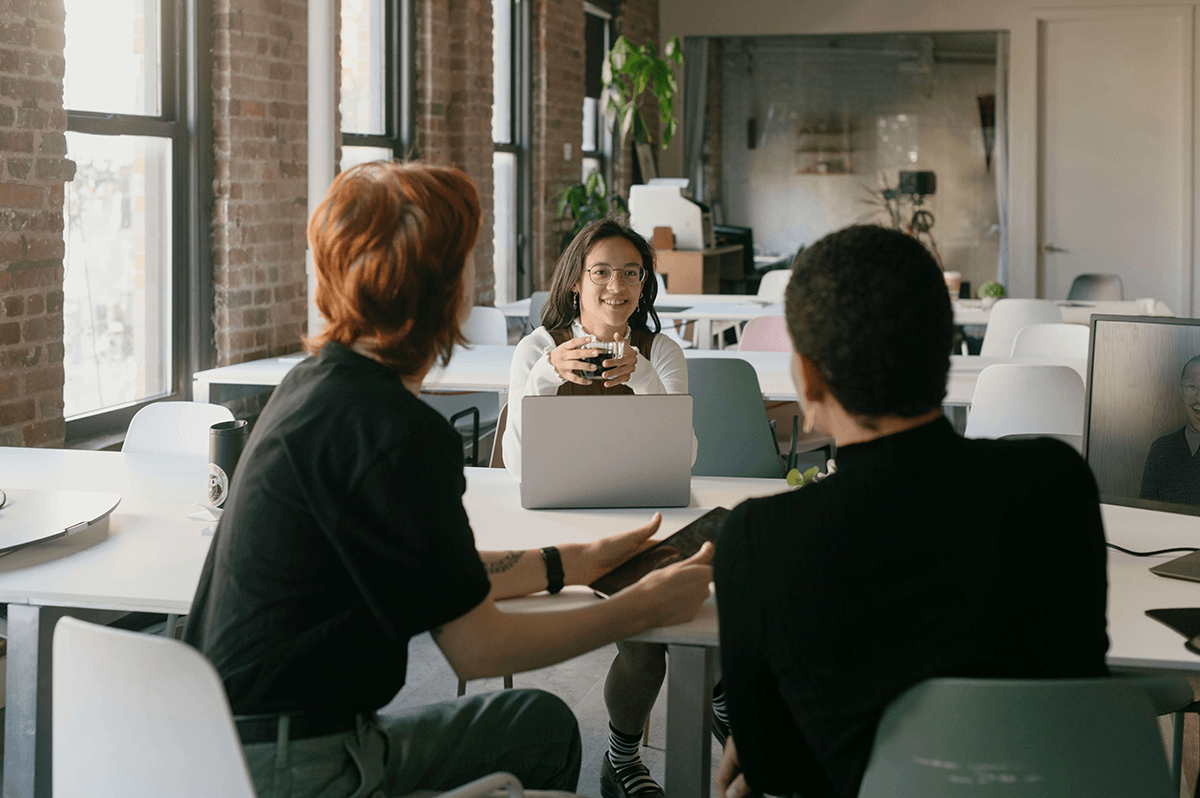 Team meeting with Cue capturing notes